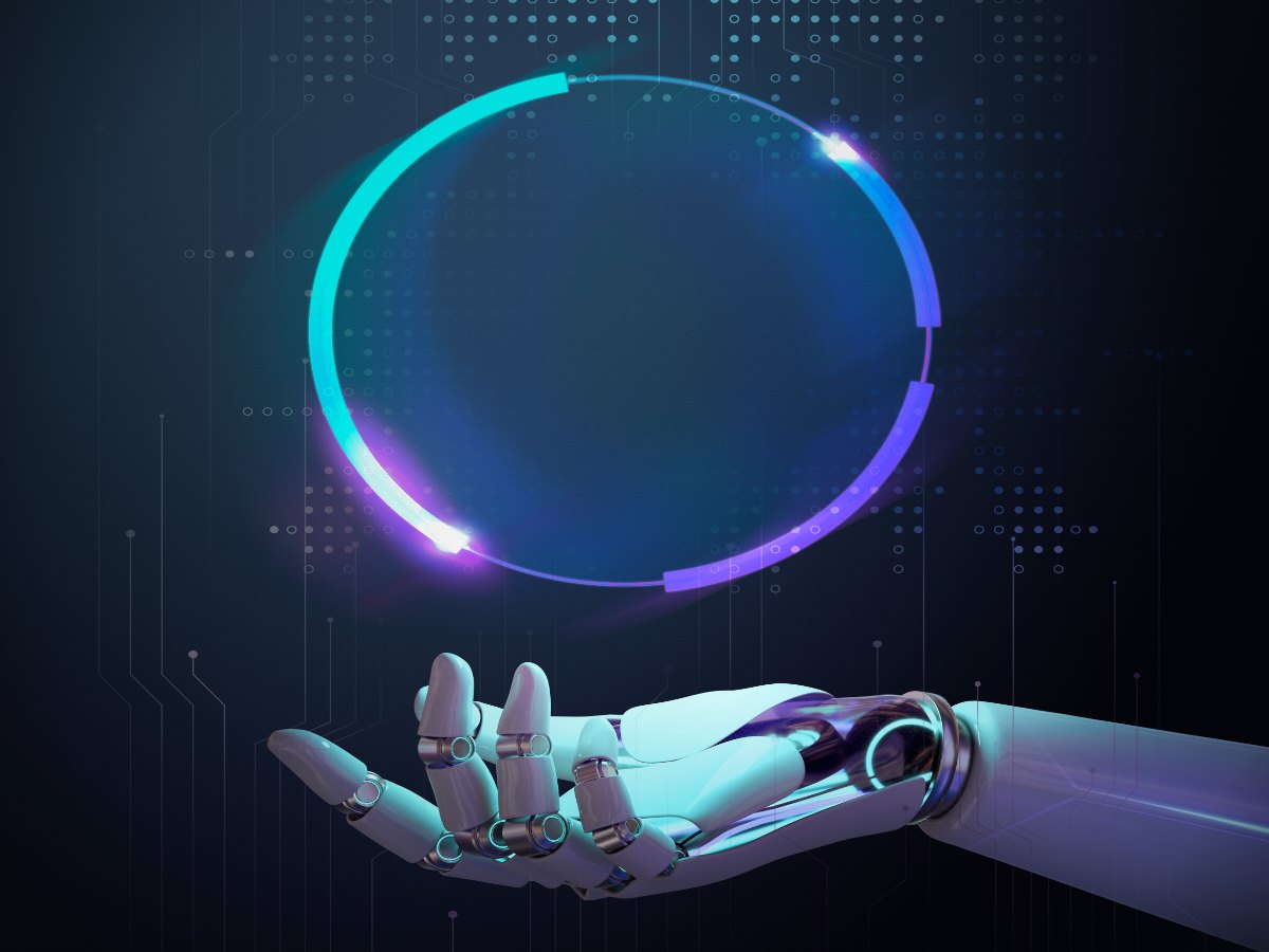 Articulated machine hand interacting with a luminous spatial interface, representing embodied and immersive intelligence.